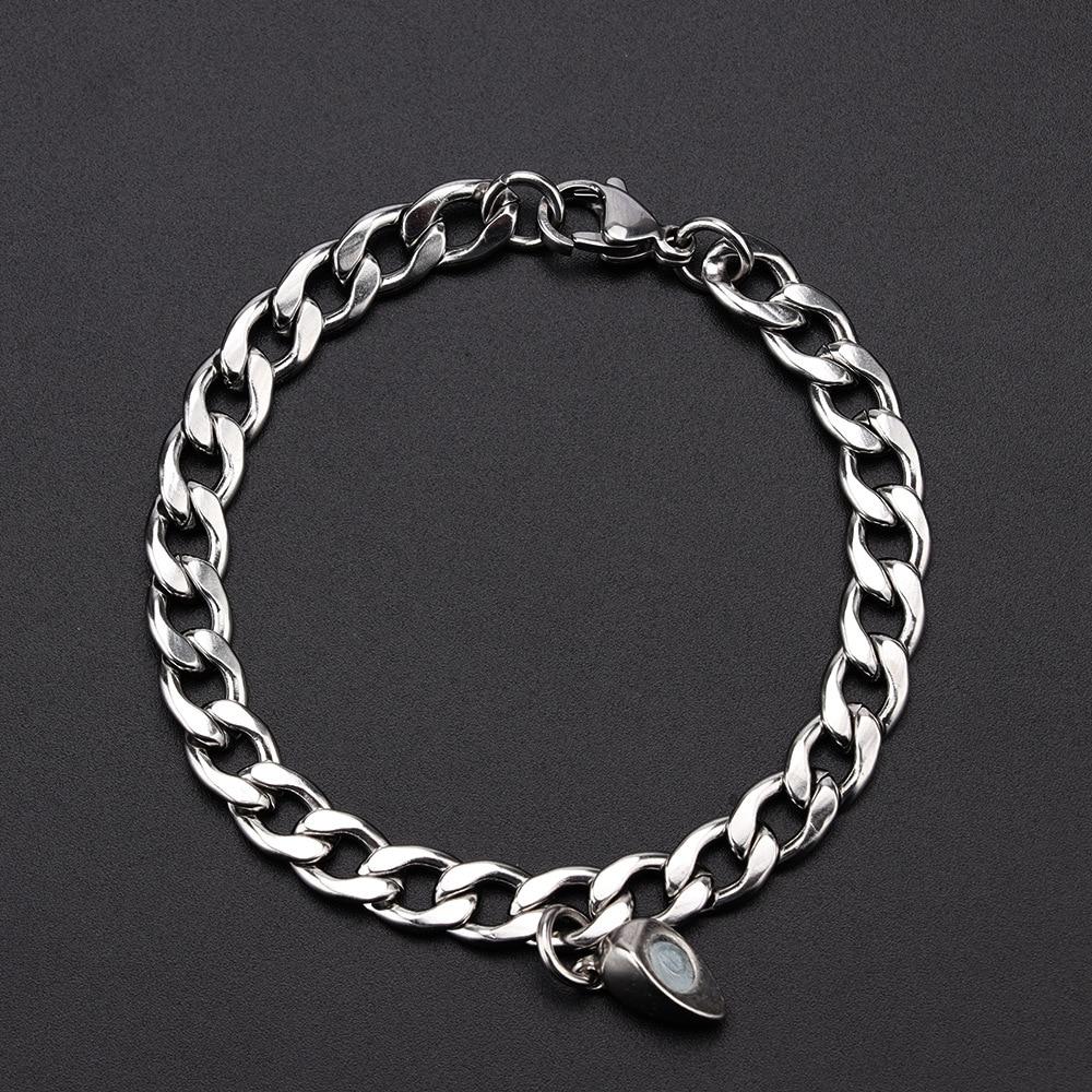 Stainless Steel Couple Bracelets featuring Magnetism Heart Charm and Cuba Chain design, showcasing elegance and connection.