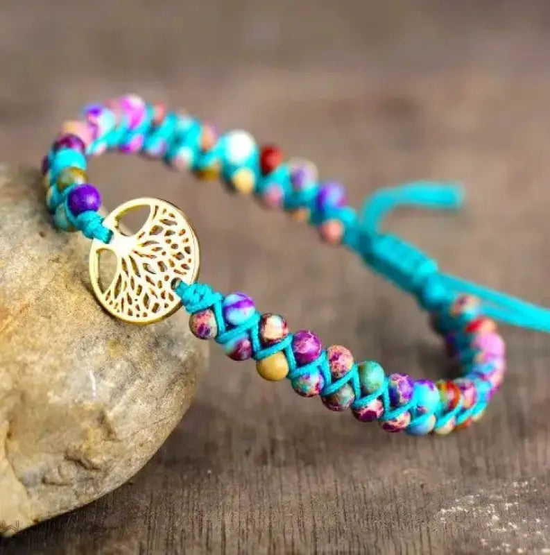 Tree of Life Imperial Jasper Bracelet featuring genuine Imperial Jasper stones and a decorative Tree of Life charm.