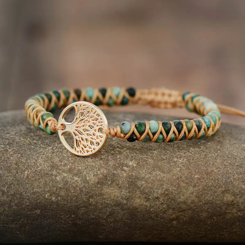 A beautifully crafted Tree of Life Jasper Bracelet made from unique natural jasper stones, showcasing intricate patterns and a bohemian style.