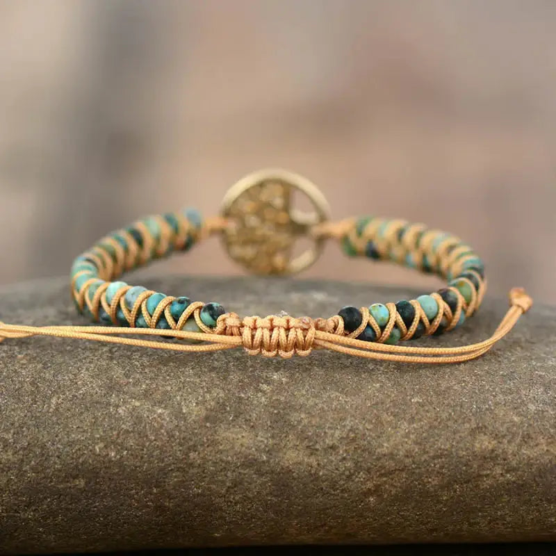 A beautifully crafted Tree of Life Jasper Bracelet made from unique natural jasper stones, showcasing intricate patterns and a bohemian style.