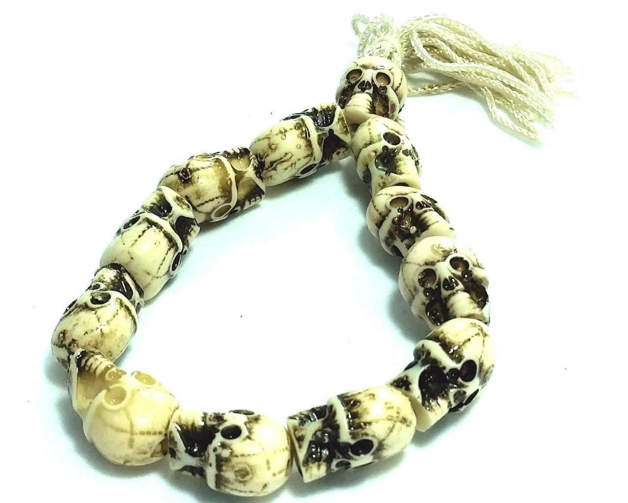 Tribal Skull Bracelet featuring a bone skull design with a cotton thread tassel, showcasing its edgy and boho chic style.