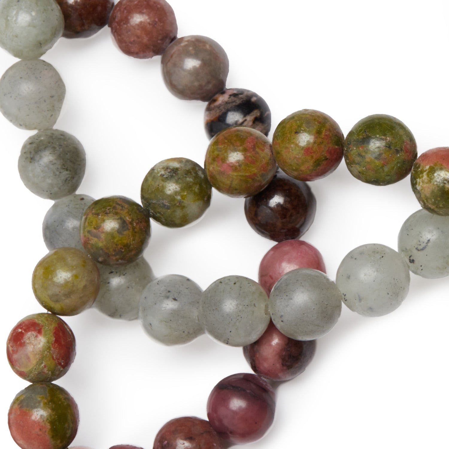 Set de trois bracelets 'Guérison du Coeur' en rhodonite, labradorite et unakite, symbolisant l'amour et la paix intérieure.