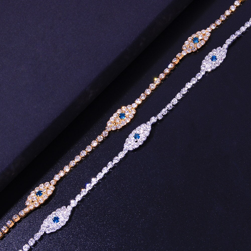 Vintage Blue Evil Eye Anklet Bracelet featuring cubic zirconia, gold and silver materials, and a lobster claw closure, elegantly displayed.