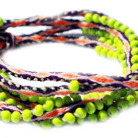 Washed Out Lime Beaded Tie Wraps featuring vibrant electric orange and purple colors, handwoven alpaca blend textile, and Czech beads.