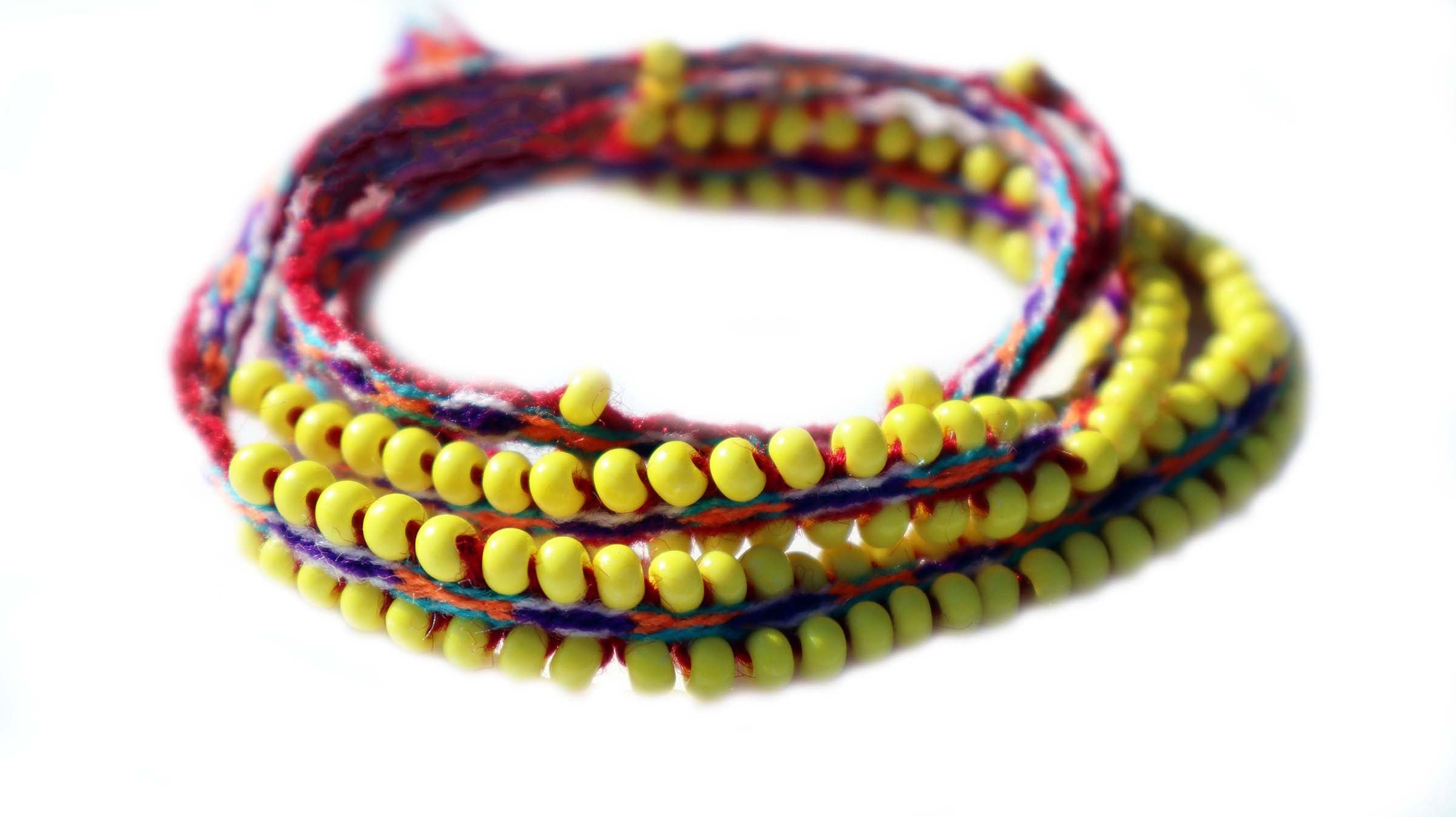 Washed Out Yellow Beaded Tie Wraps featuring handwoven alpaca blend textile and colorful Czech beads, styled as a bracelet and choker.