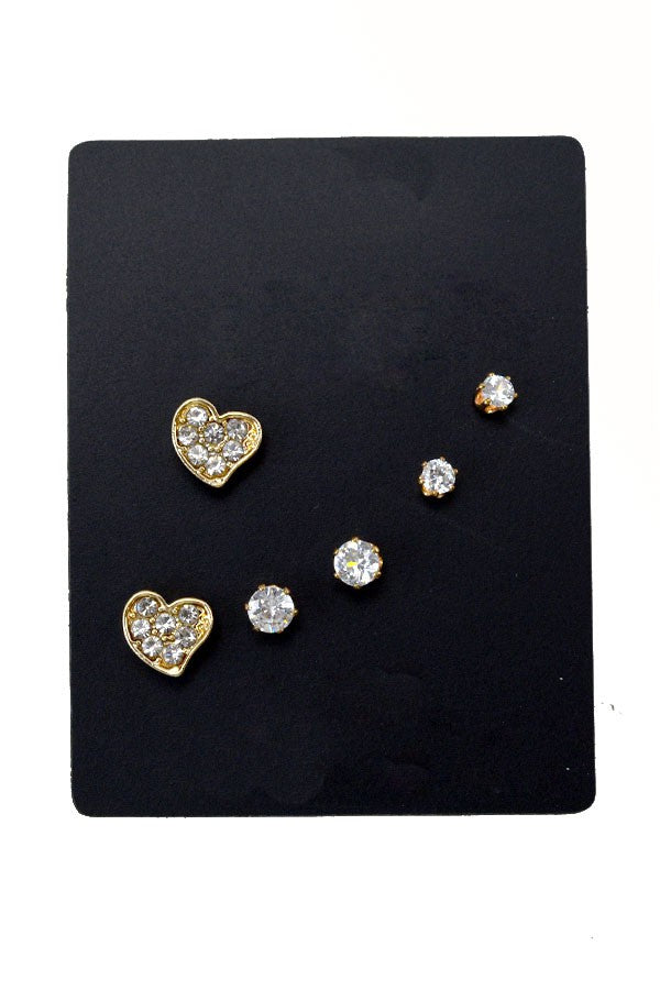 Three pairs of stylish stud earrings in various designs, showcasing their elegance and versatility.