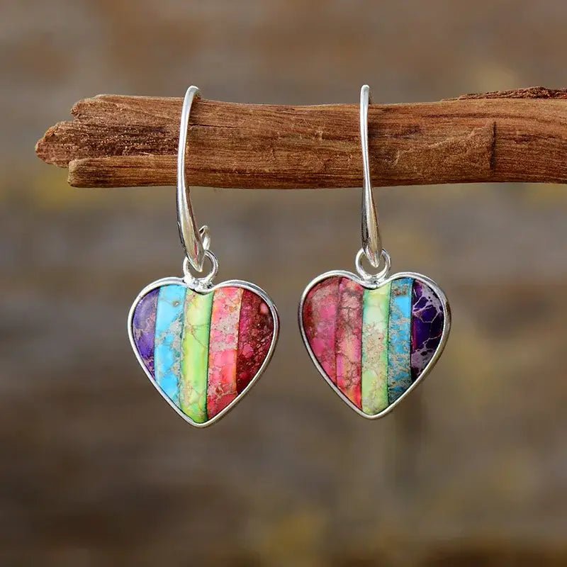 A pair of handcrafted 7 Chakra Heart Earrings made with natural Imperial Jasper stones, showcasing vibrant colors and a bohemian design.