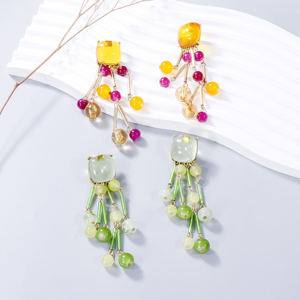 A pair of stylish acrylic bead dangle earrings featuring colorful beads and a sleek alloy design, perfect for any outfit.