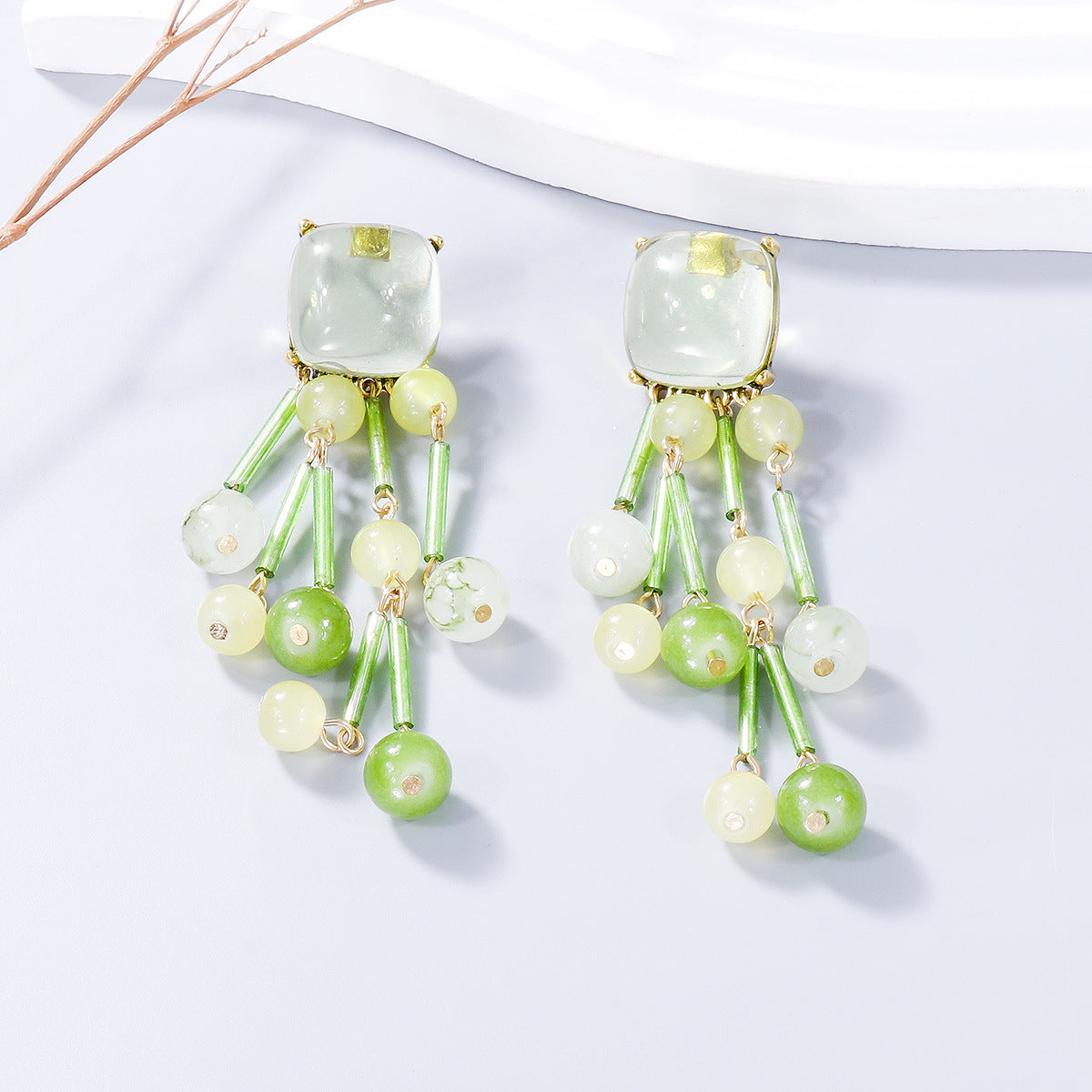 A pair of stylish acrylic bead dangle earrings featuring colorful beads and a sleek alloy design, perfect for any outfit.