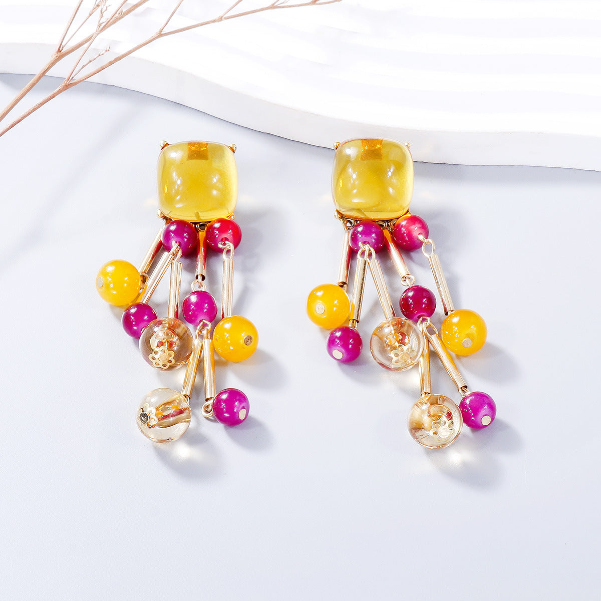 A pair of stylish acrylic bead dangle earrings featuring colorful beads and a sleek alloy design, perfect for any outfit.