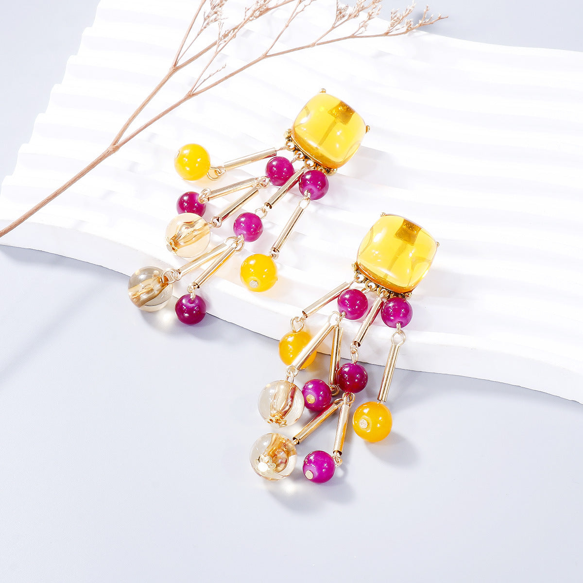 A pair of stylish acrylic bead dangle earrings featuring colorful beads and a sleek alloy design, perfect for any outfit.