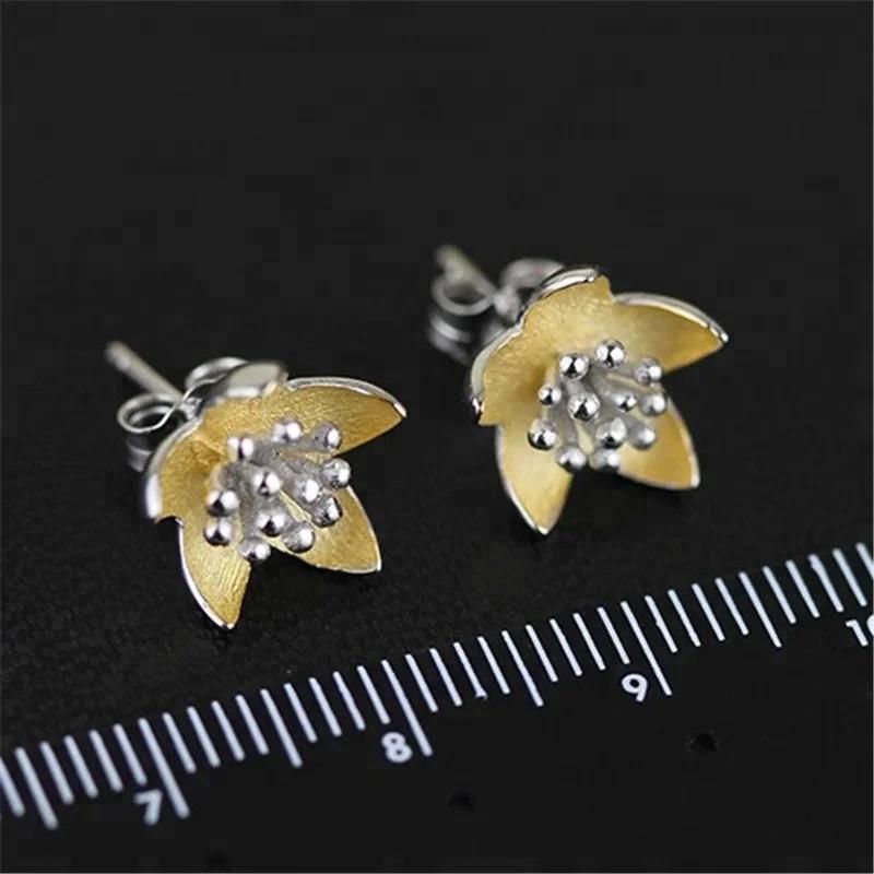 Elegant Adonis Stud Earrings featuring a flower design, crafted from 18K gold-plated sterling silver.