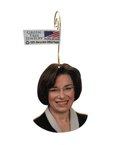 Amy Klobuchar Ornament #T046 made from eco-friendly birch wood and recycled paper, featuring a glossy finish and essential oil diffuser capability.