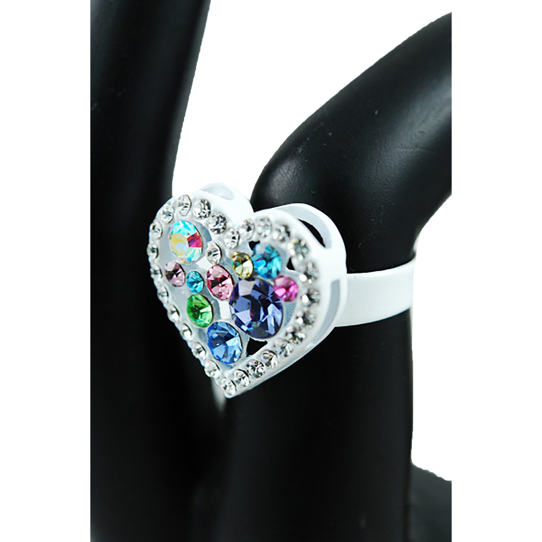 Heart-shaped ring with colorful gemstones.