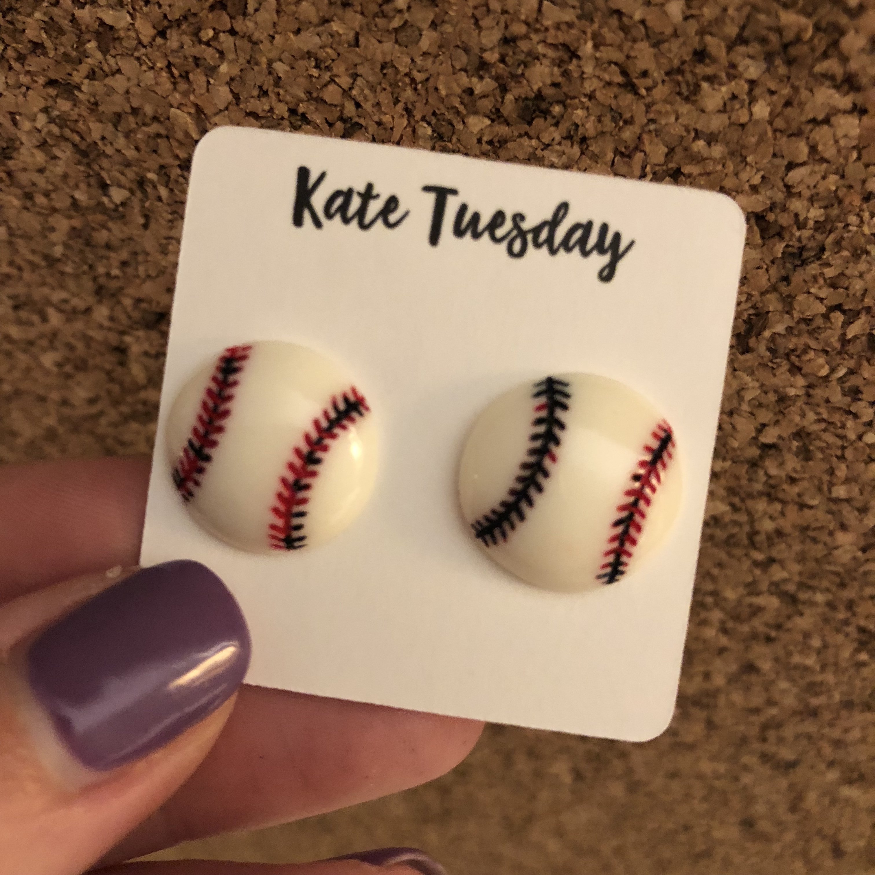 A pair of Baseball Stud Earrings in 14mm and 10mm sizes, showcasing a baseball design with a shiny finish.