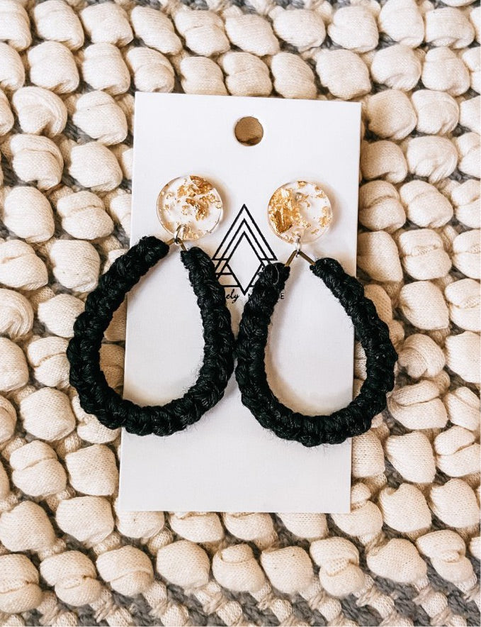 A pair of elegant Black Gems made from macrame cotton and resin, showcasing a lightweight and stylish design.