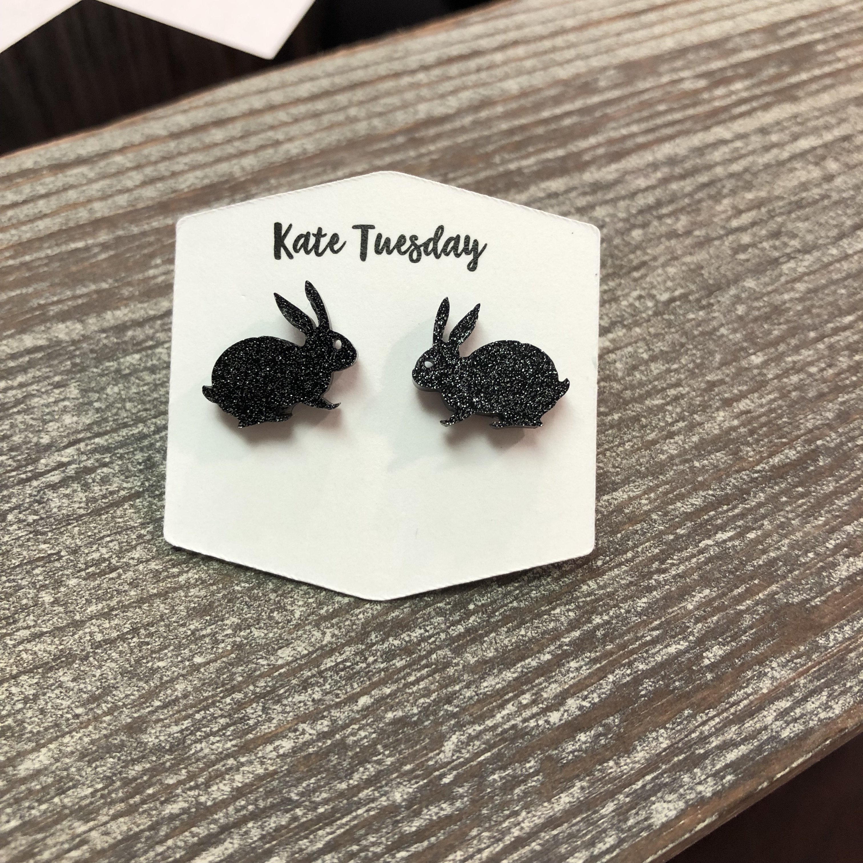 Black glitter bunny rabbit stud earrings with sparkling design, perfect for Easter celebrations.