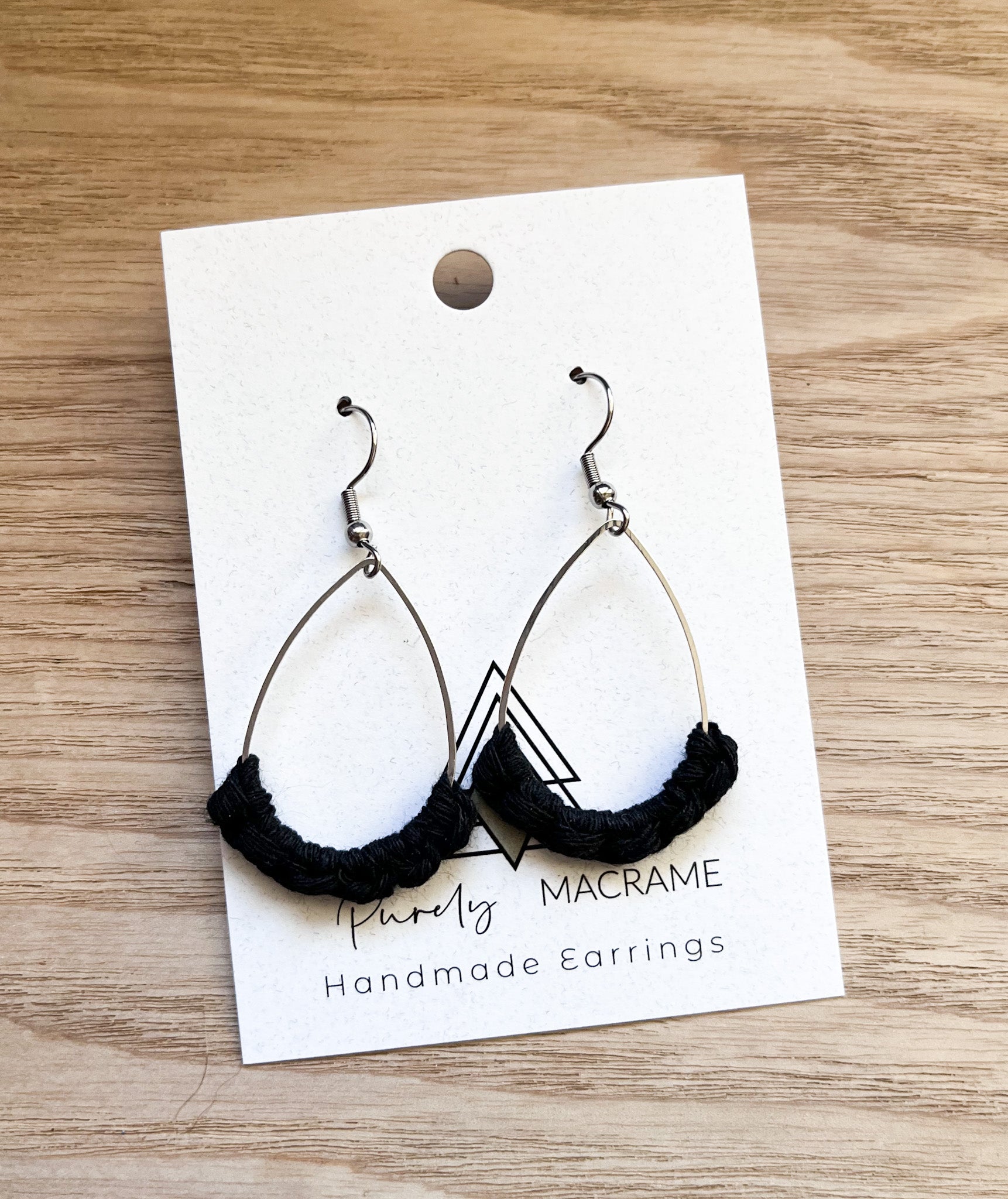 Elegant Black Silver Teardrop earrings made from 100% macrame cotton, featuring a lightweight design and stylish color combination.