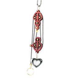 Block and Tackle Pulley Heart Necklace 7005C featuring a cherry red heart pendant and brass circle, showcasing its unique design and functionality.