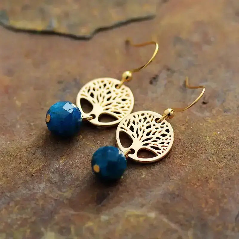 Handmade Blue Apatite Tree of Life Earrings featuring vibrant blue gemstones in a symbolic design.