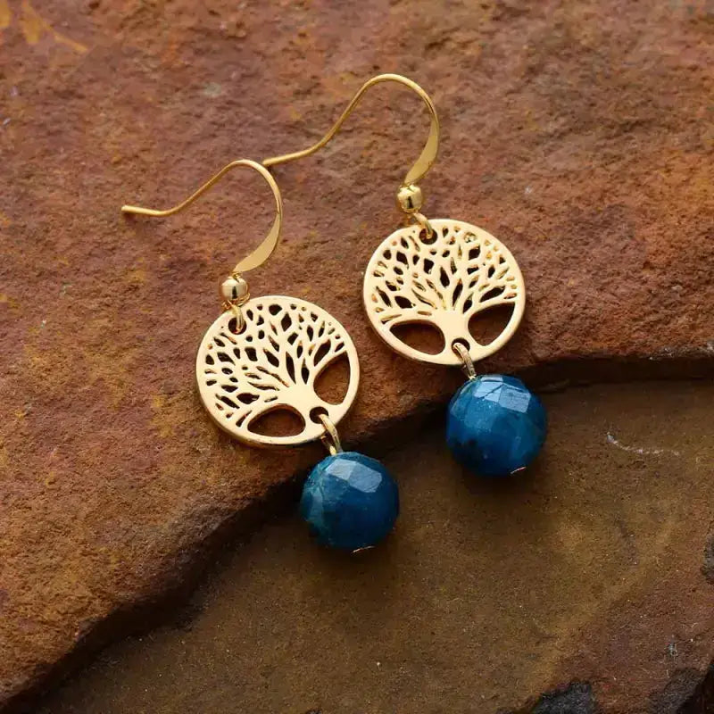 Handmade Blue Apatite Tree of Life Earrings featuring vibrant blue gemstones in a symbolic design.