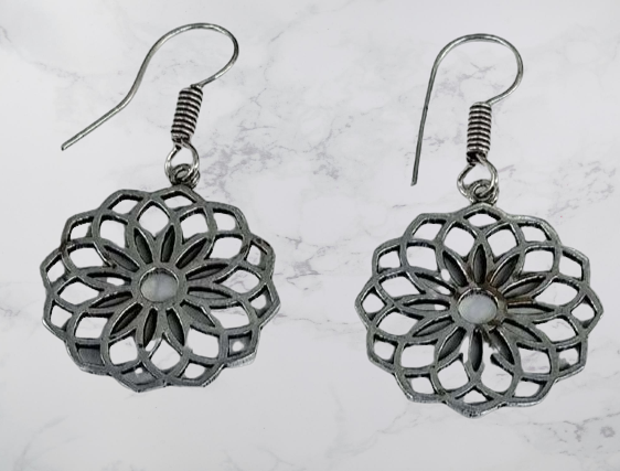 Bohotusk Flower Petal Earrings in Brass and Oxidised Silver with intricate petal detailing, showcasing their elegant design.