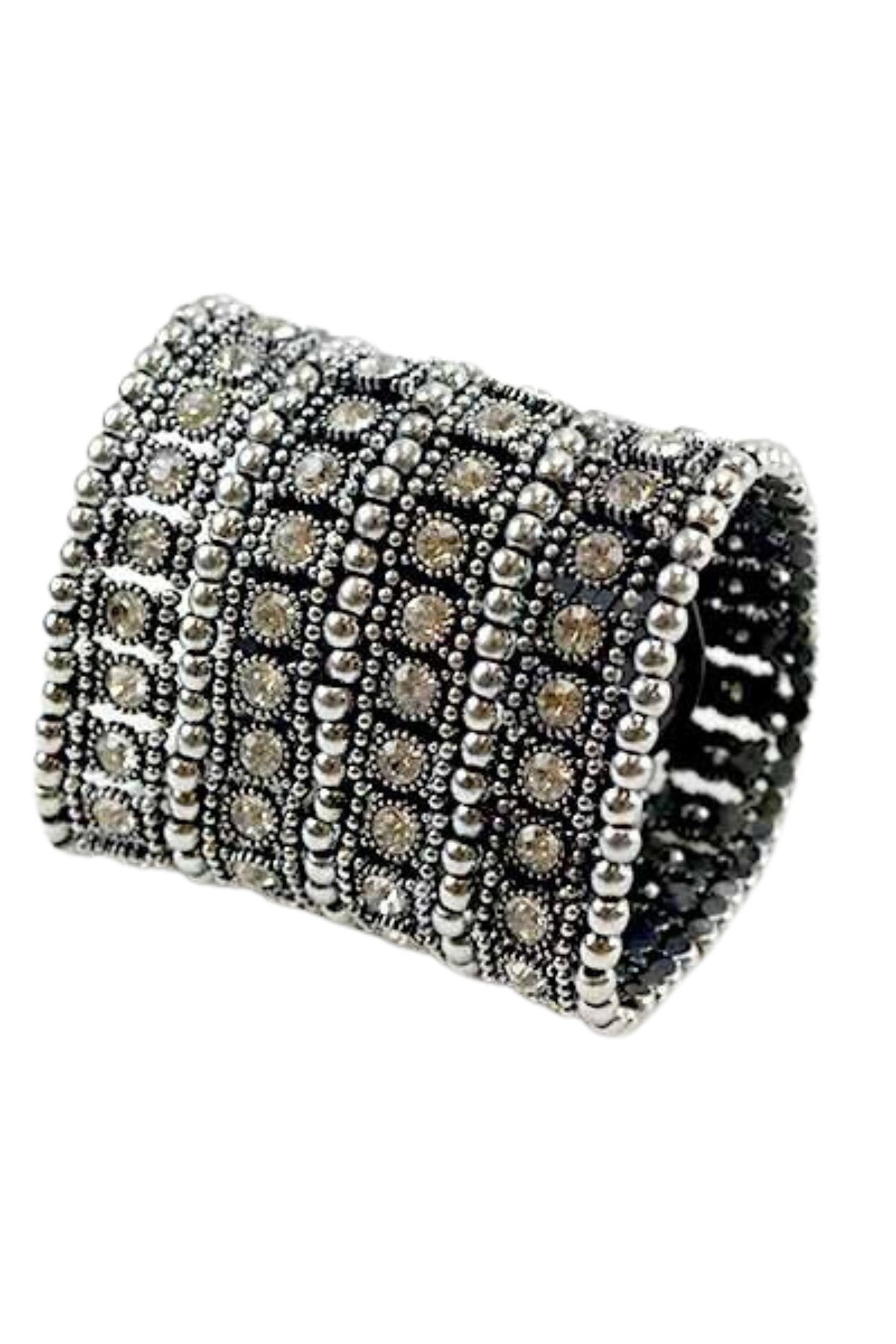 A beautiful studded crystal bracelet with a stretchable design, showcasing sparkling crystals set in a stylish arrangement.