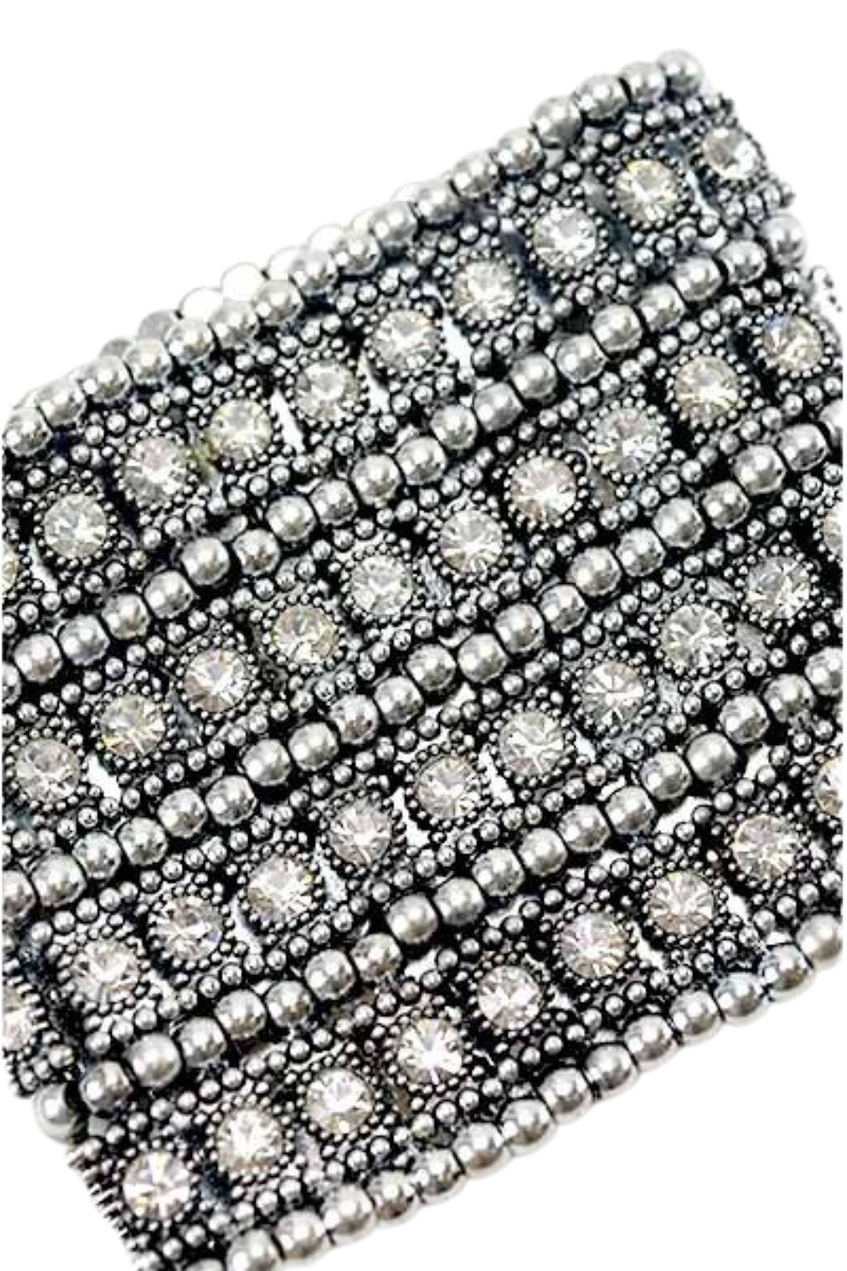 A beautiful studded crystal bracelet with a stretchable design, showcasing sparkling crystals set in a stylish arrangement.