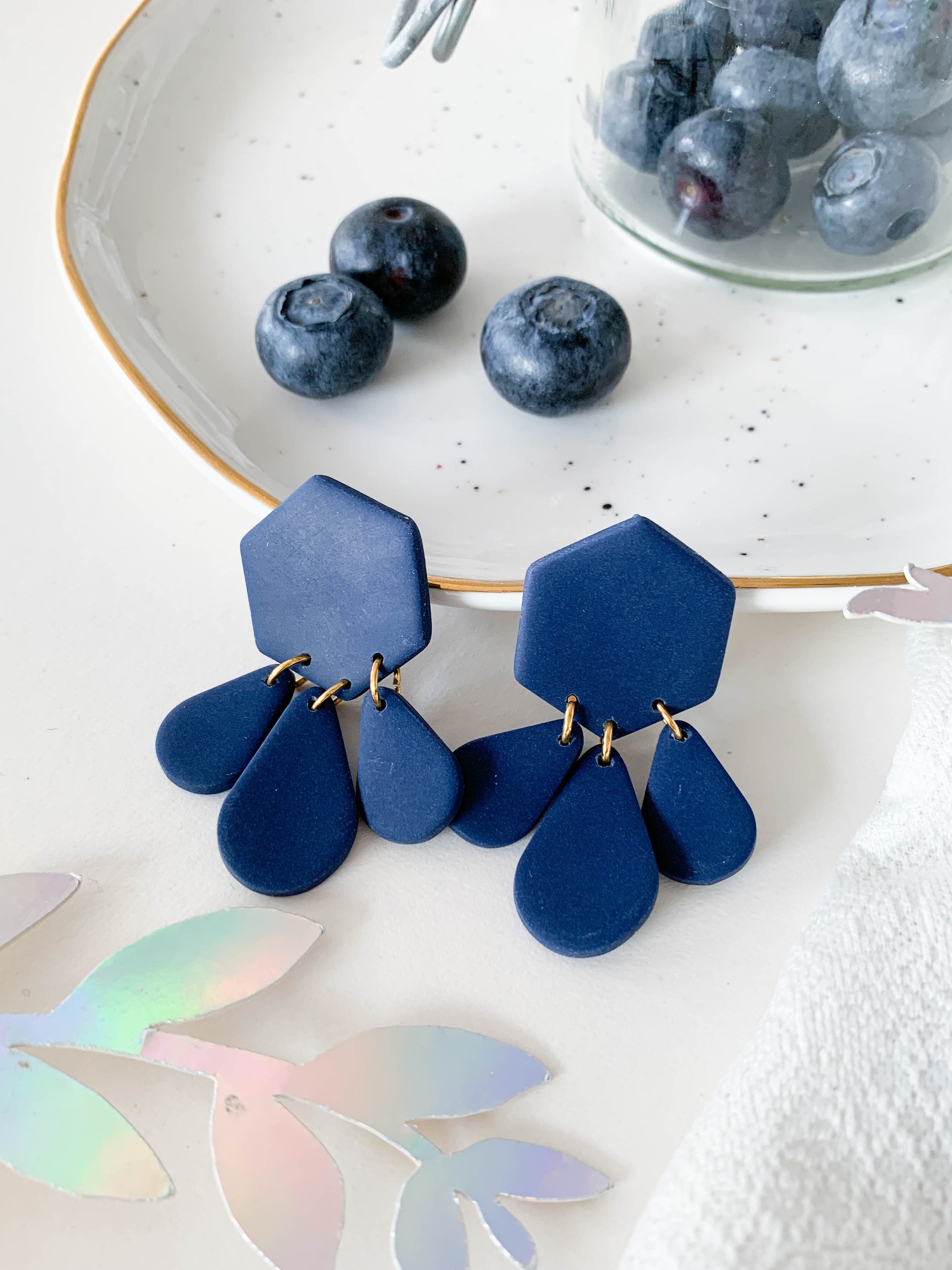 Bridget Blueberry dangle earrings featuring a modern hexagon teardrop design in vibrant blueberry color, perfect for stylish accessorizing.