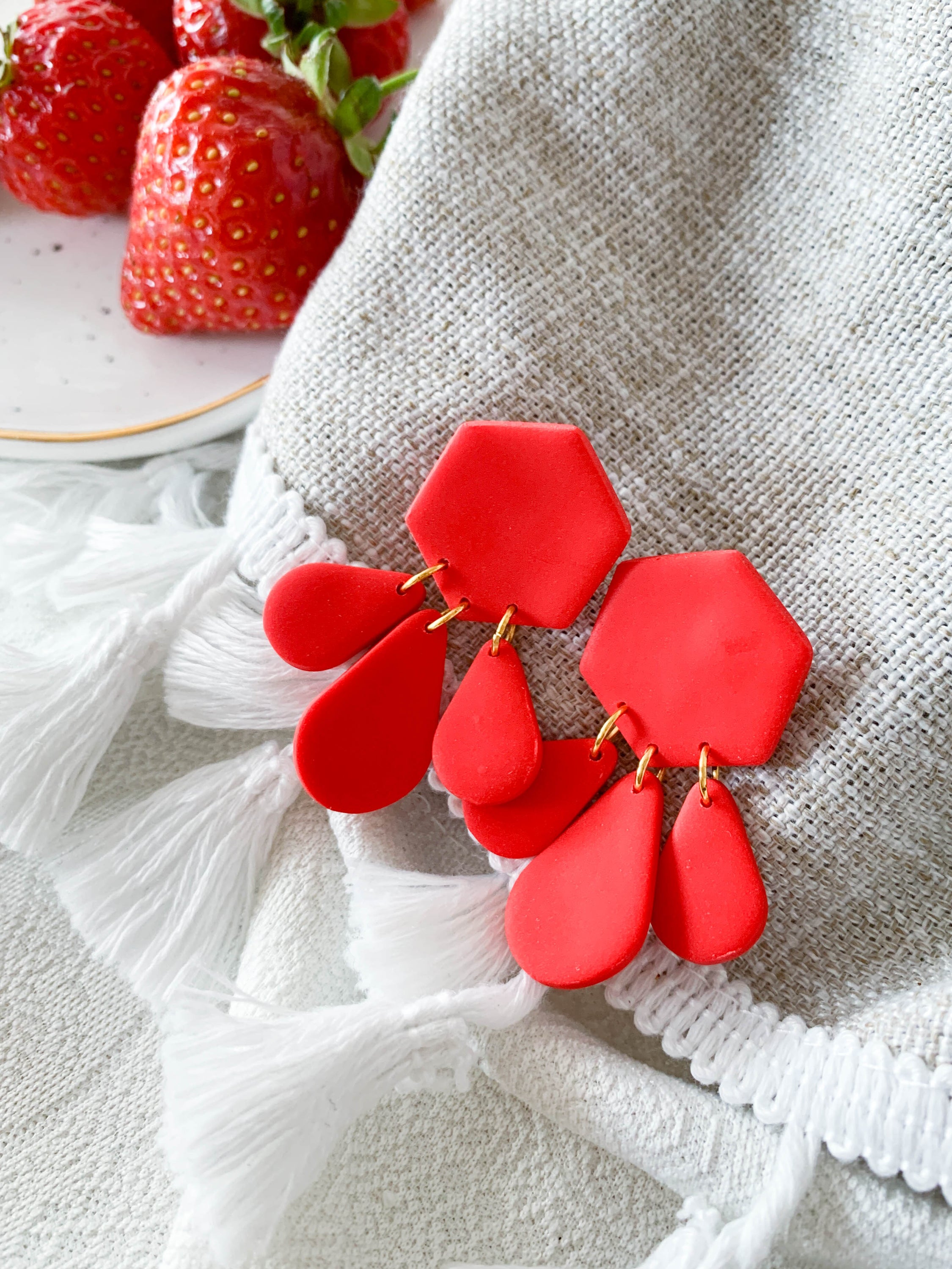 Bridget Strawberry geometric hexagon teardrop dangle earrings in vibrant red and green colors, showcasing a modern design.