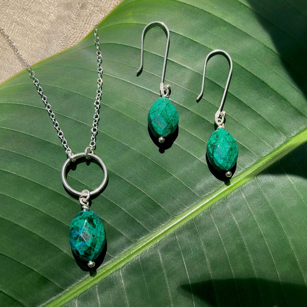 Elegant Chrysocolla drop earrings featuring vibrant emerald green gemstones set in sterling silver, handmade in Peru.