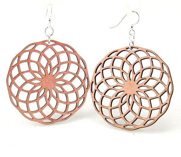 Circumscribe Circle Earrings in pink, made from sustainably sourced wood with silver-finished stainless steel ear wires.