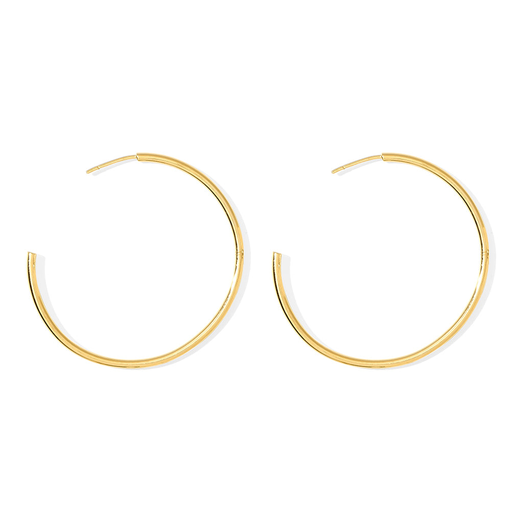 Classic Bombshell Hoop Earrings handcrafted from recycled materials with gold plating, showcasing elegance and sustainability.