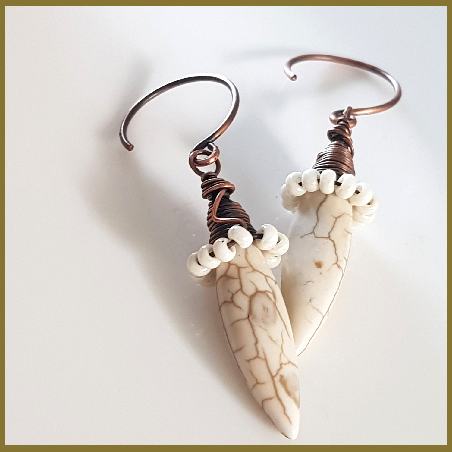 Copper Wire Wrapped Howlite Spike Earrings with white seed beads and handmade oxidized circle ear wires, showcasing a unique and elegant design.