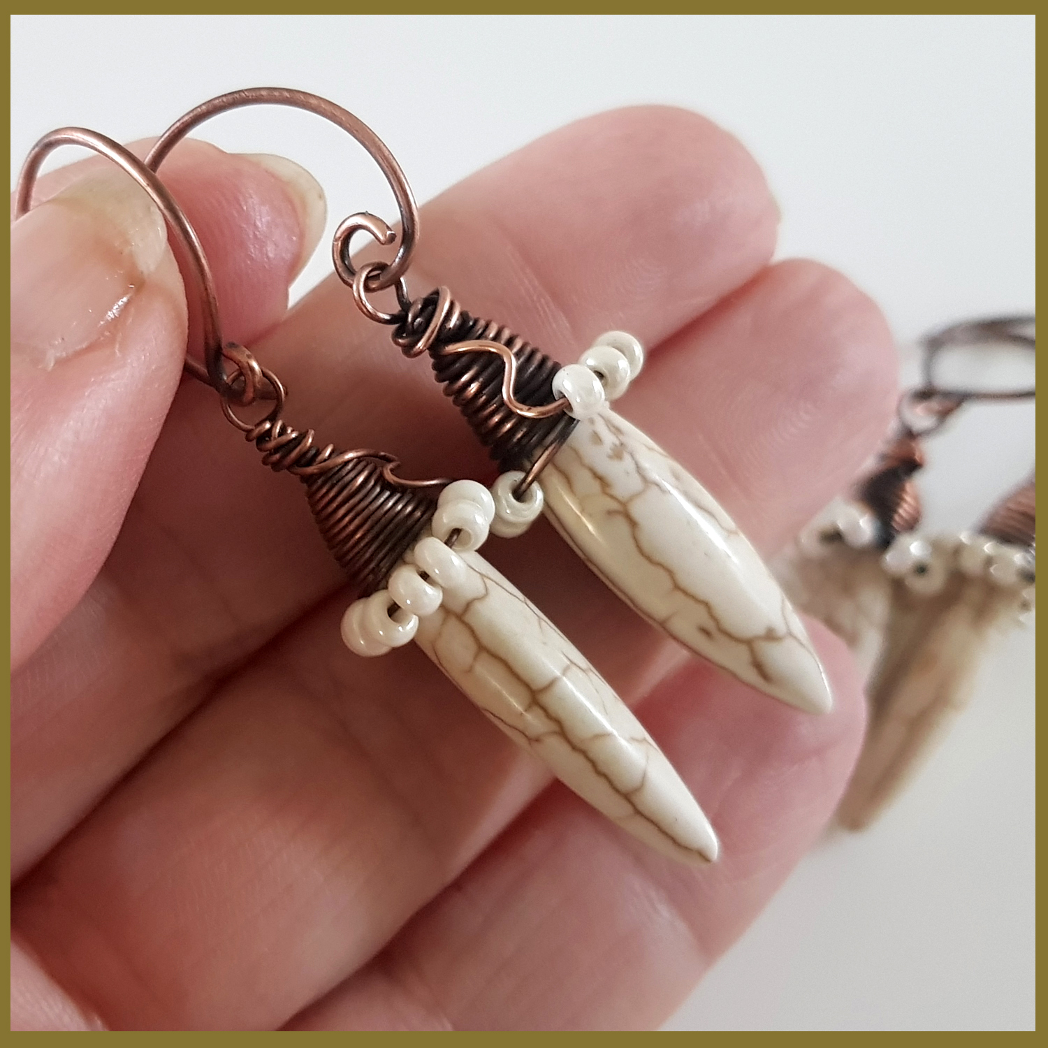 Copper Wire Wrapped Howlite Spike Earrings with white seed beads and handmade oxidized circle ear wires, showcasing a unique and elegant design.