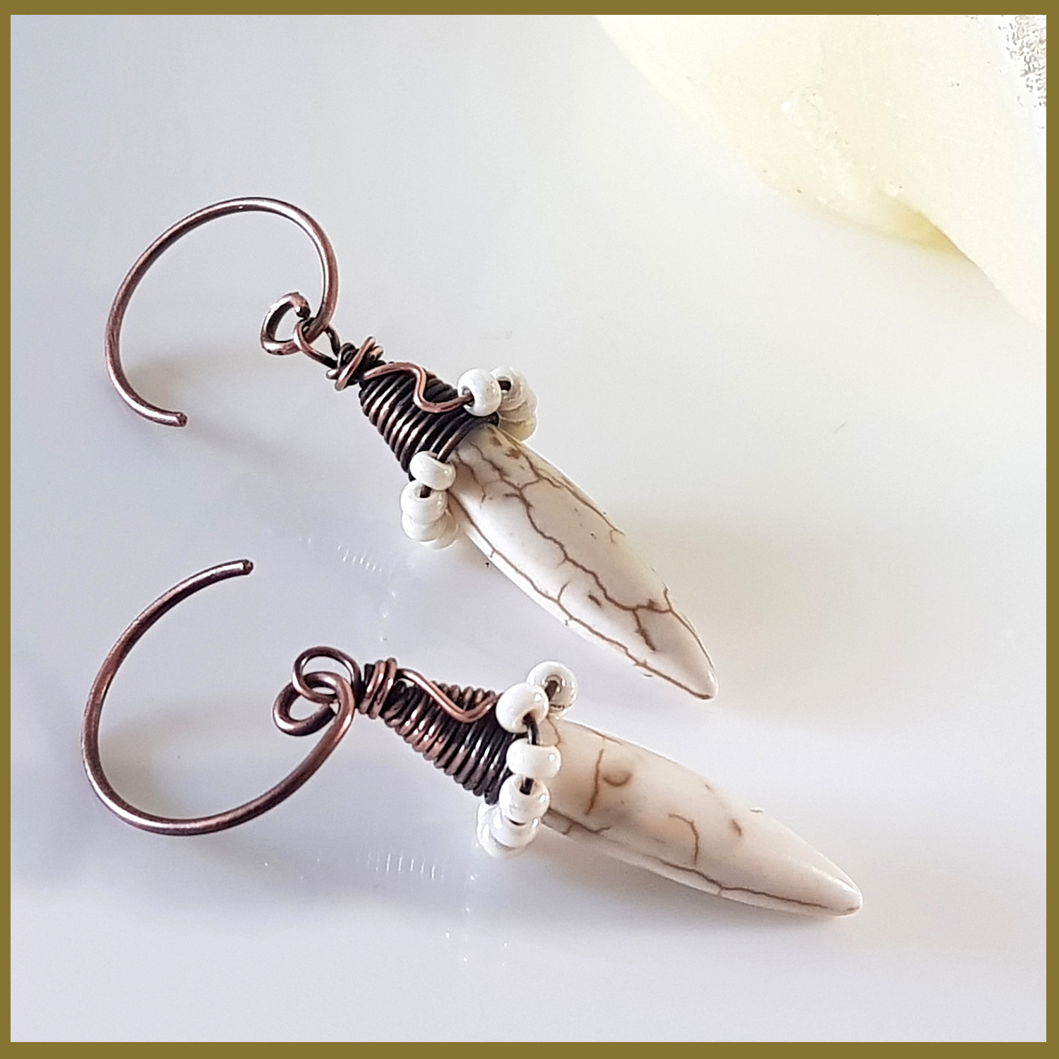 Copper Wire Wrapped Howlite Spike Earrings with white seed beads and handmade oxidized circle ear wires, showcasing a unique and elegant design.