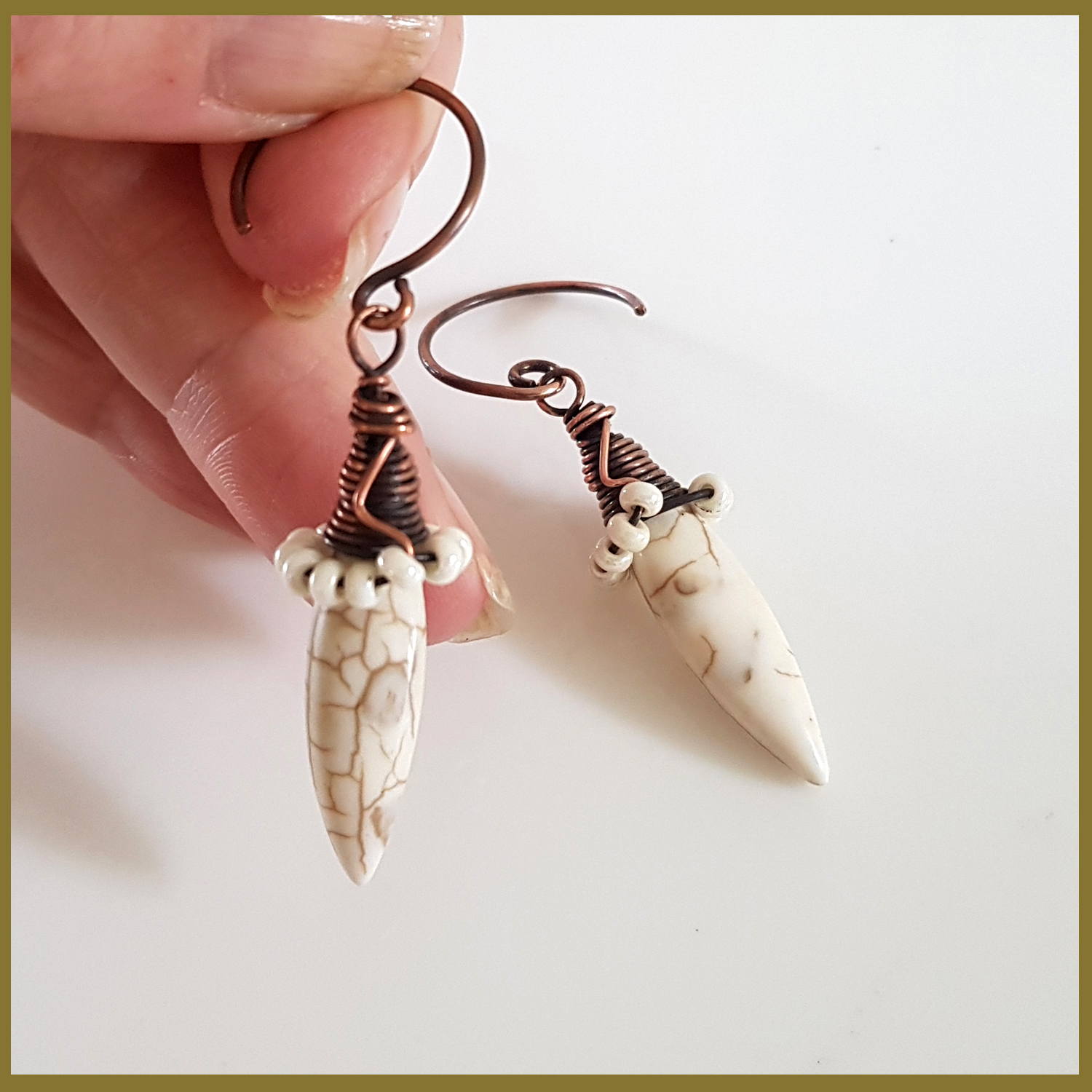 Copper Wire Wrapped Howlite Spike Earrings with white seed beads and handmade oxidized circle ear wires, showcasing a unique and elegant design.