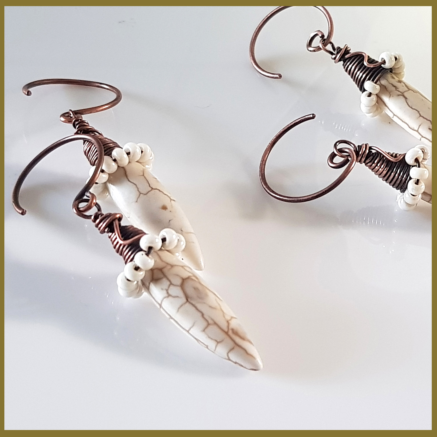 Copper Wire Wrapped Howlite Spike Earrings with white seed beads and handmade oxidized circle ear wires, showcasing a unique and elegant design.