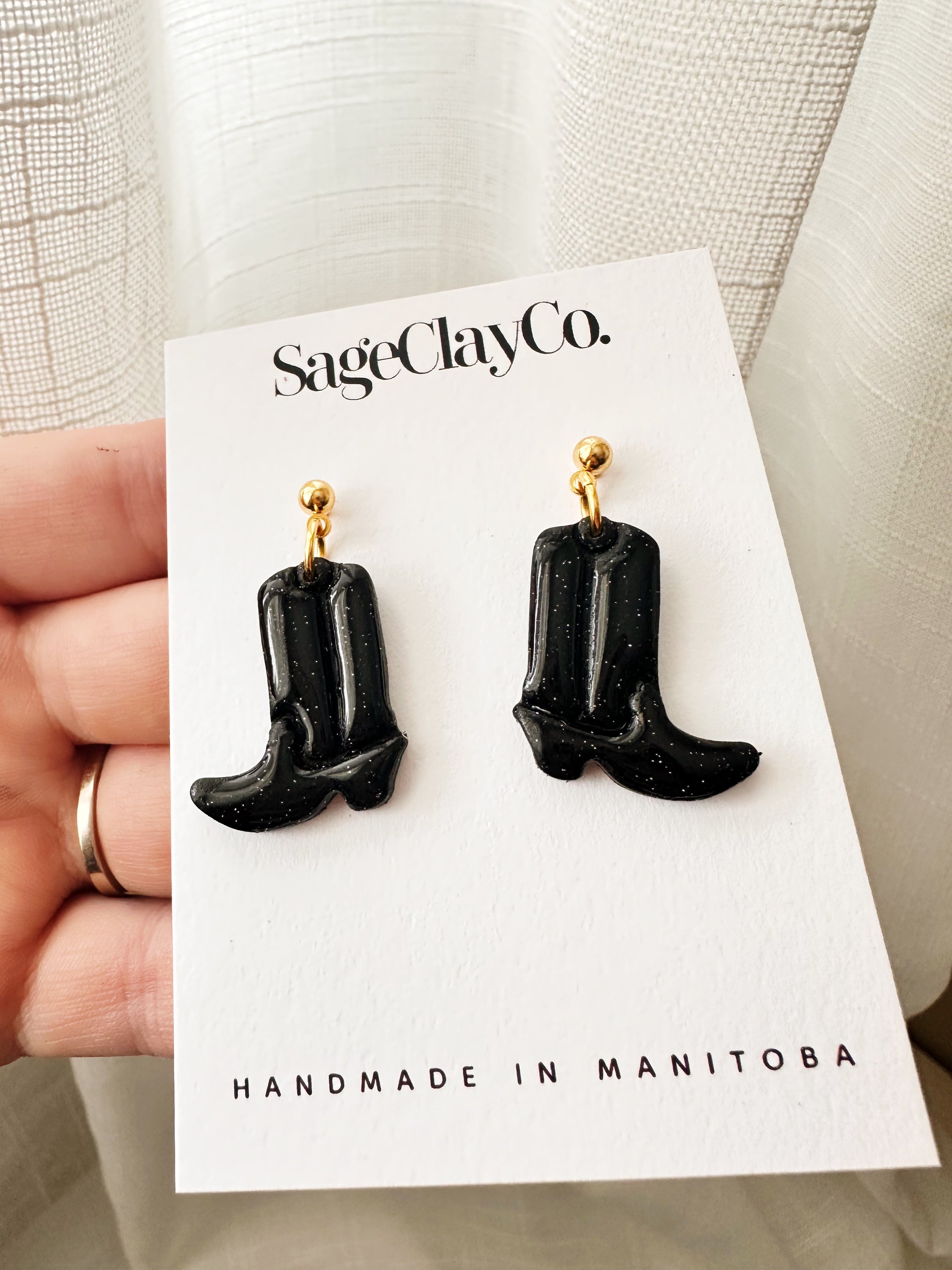 Handmade polymer clay cowboy boots dangle earrings, featuring unique designs and vibrant colors, lightweight and hypoallergenic for comfortable wear.