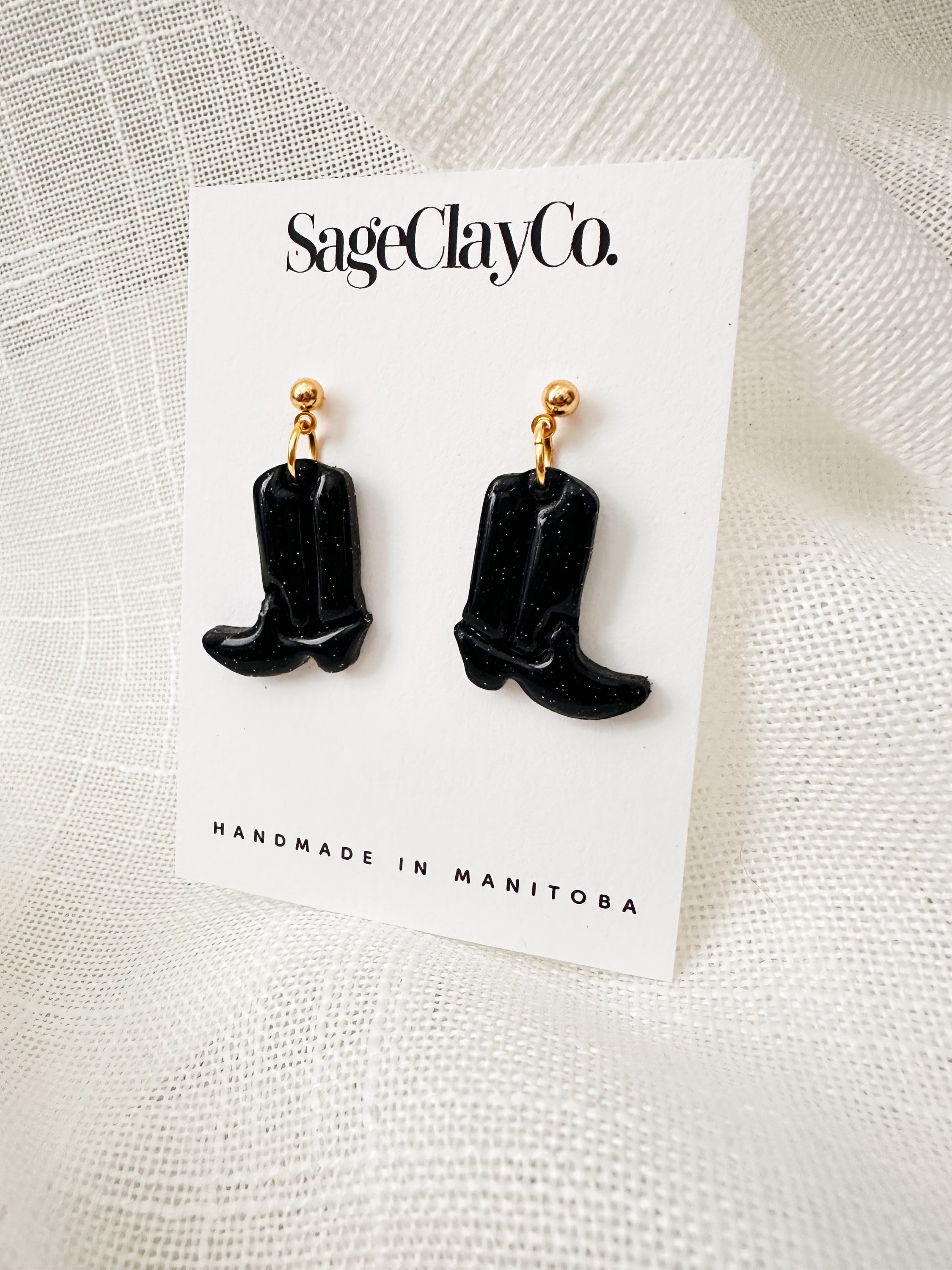 Handmade polymer clay cowboy boots dangle earrings, featuring unique designs and vibrant colors, lightweight and hypoallergenic for comfortable wear.