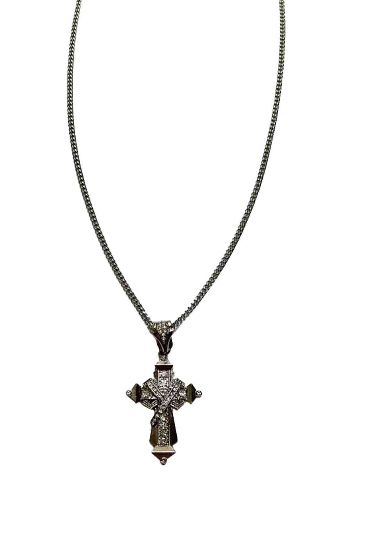 A long necklace featuring a cross pendant adorned with rhinestones, showcasing elegance and style.