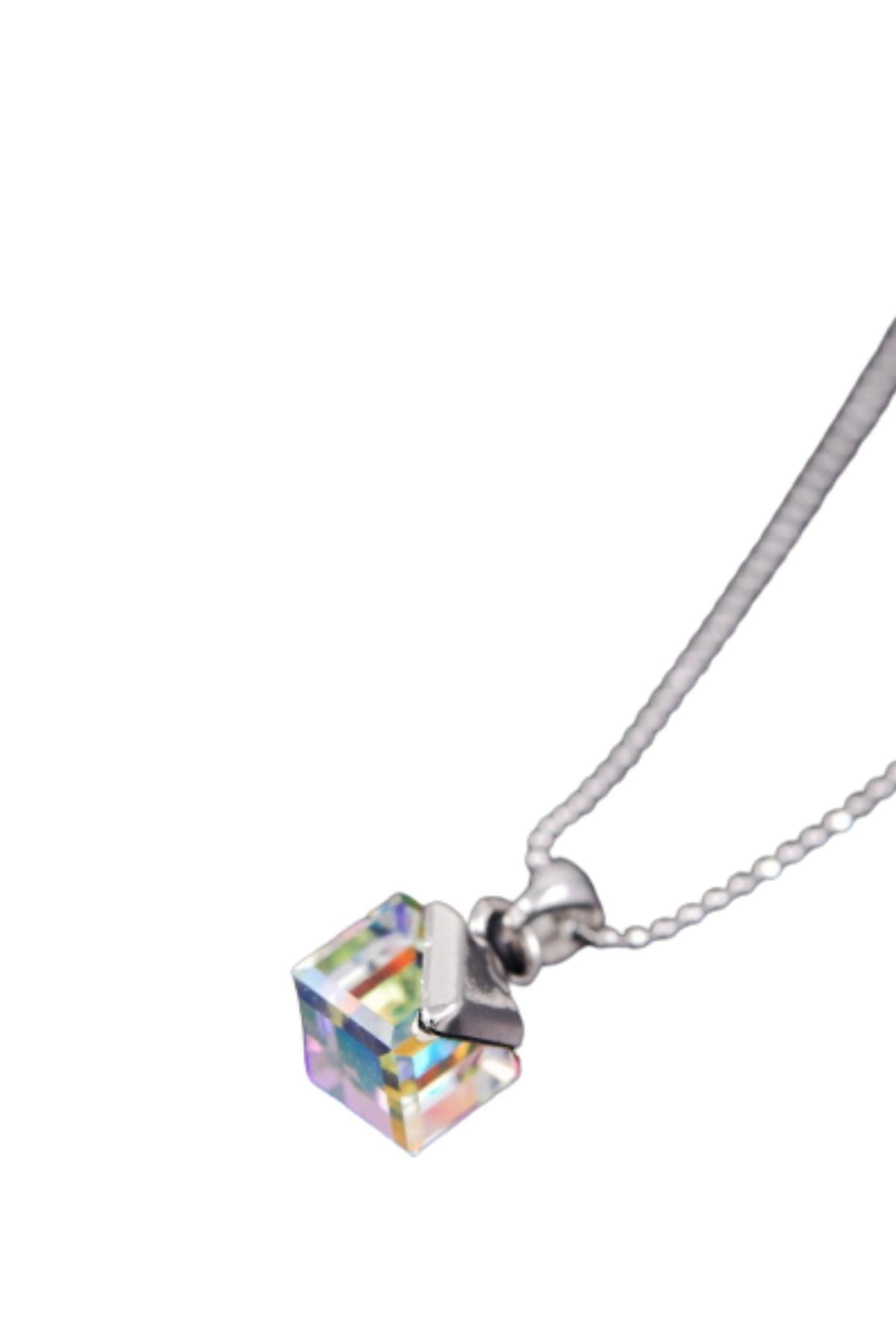 Necklace with a crystal cube pendant.