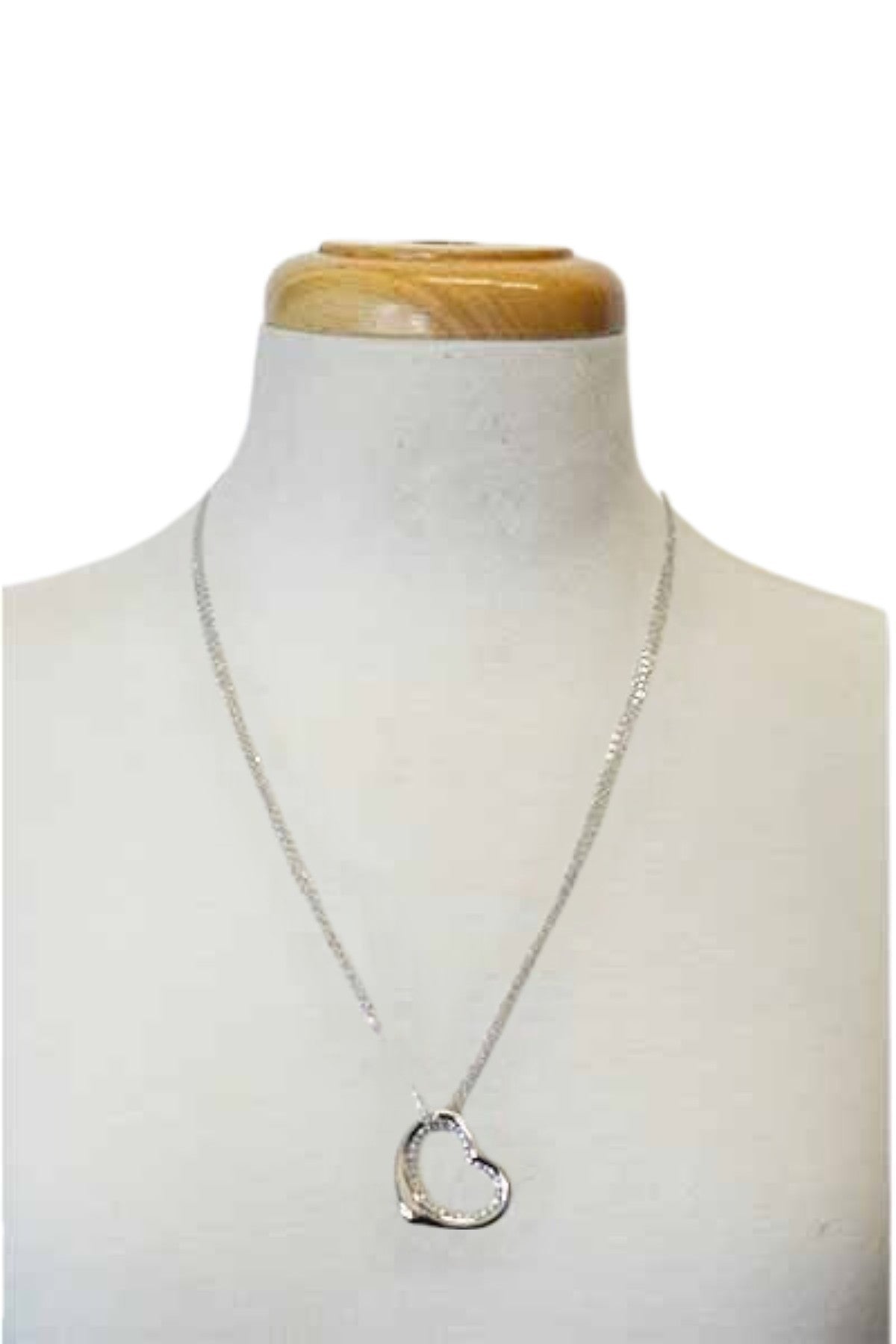 A stunning crystal cut out heart pendant necklace with a double plated finish and a 24-inch chain.