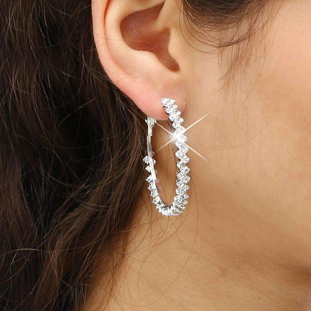 Elegant crystal hoop earrings featuring a zig-zag design made with Austrian crystals and high-quality zinc alloy.