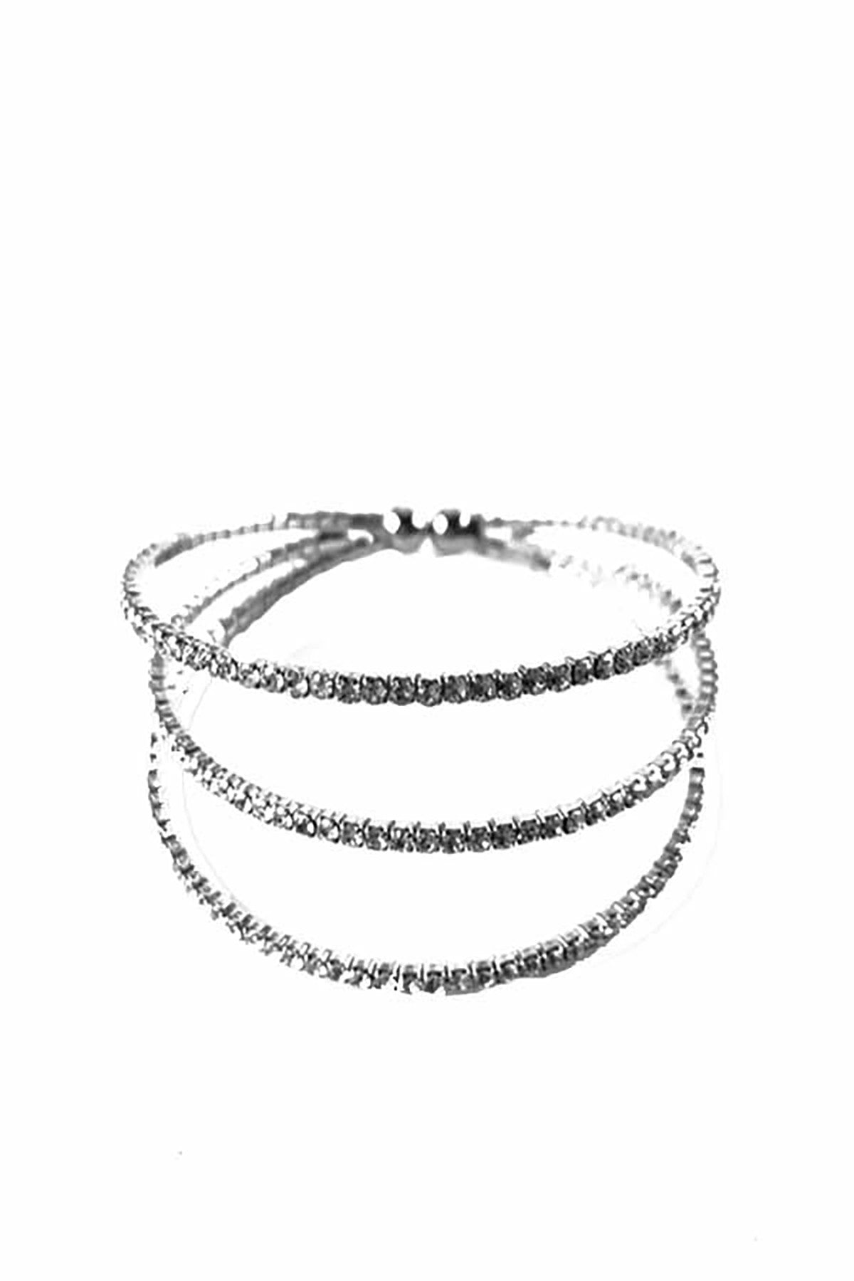 A stylish crystal lined cuff bracelet with an adjustable design, showcasing sparkling crystals on a sleek metal band.