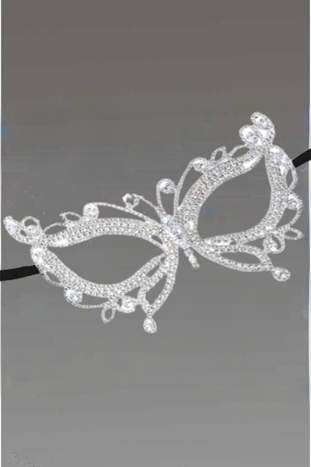 Elegant Crystal Butterfly Masquerade Mask with black ribbon ties, showcasing intricate design.