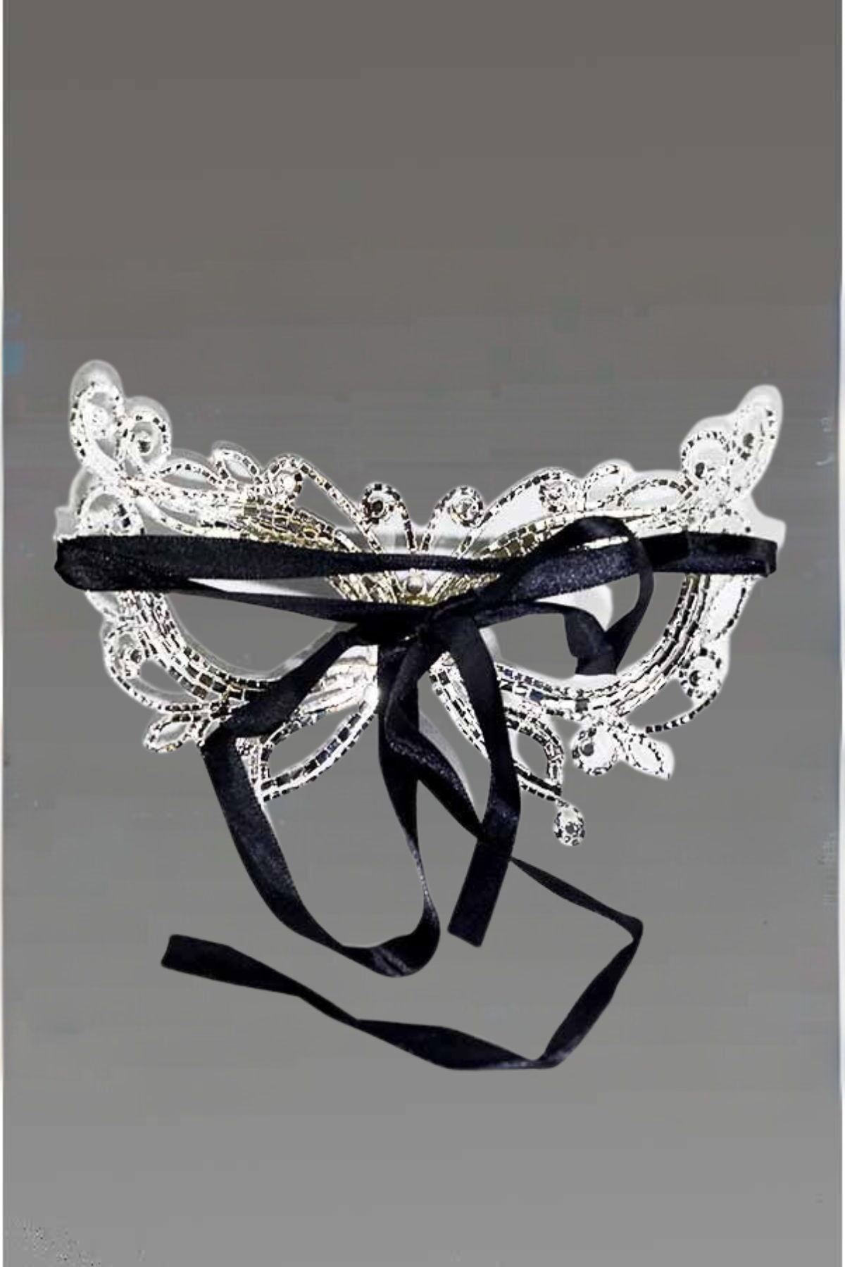 Elegant Crystal Butterfly Masquerade Mask with black ribbon ties, showcasing intricate design.