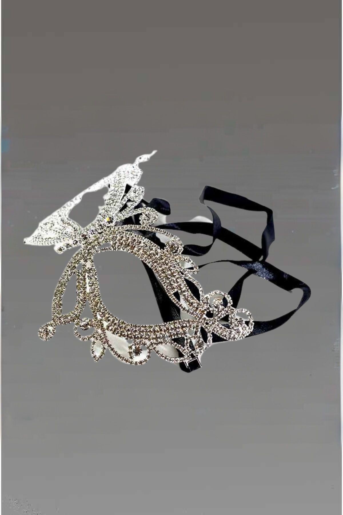 Elegant Crystal Butterfly Masquerade Mask with black ribbon ties, showcasing intricate design.