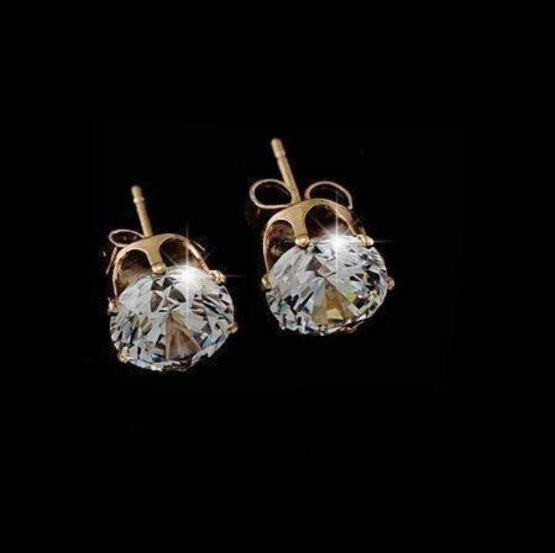 A pair of elegant crystal stud earrings in silver and gold settings, showcasing their sparkling crystals and lightweight design.