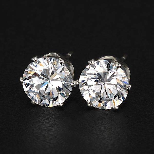 A pair of elegant crystal stud earrings in silver and gold settings, showcasing their sparkling crystals and lightweight design.